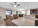 Open concept living room and kitchen area with natural light and tile flooring at 314 N 79Th Pl, Mesa, AZ 85207