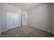 Comfortable bedroom featuring carpet, neutral walls, closet with sliding doors, and ample natural light at 35295 W La Paz St, Maricopa, AZ 85138