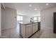 Bright kitchen features granite countertops and stainless steel appliances at 35295 W La Paz St, Maricopa, AZ 85138