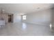 Expansive living room showcasing tile flooring, neutral walls, and recessed lighting at 35295 W La Paz St, Maricopa, AZ 85138