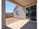 Covered patio offers an inviting space to enjoy the backyard, with easy access to the home's interior at 35295 W La Paz St, Maricopa, AZ 85138