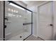 A bright shower with glass doors and tile floor at 35295 W La Paz St, Maricopa, AZ 85138