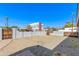 Wide-angle shot of the gravel backyard showing mature trees and desert landscaping at 3601 N 12Th St, Phoenix, AZ 85014