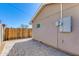 An exterior side view of home with a brick paver patio and wood fence at 3601 N 12Th St, Phoenix, AZ 85014