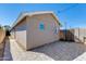 An exterior rear view of home with a brick paver patio and wood fence at 3601 N 12Th St, Phoenix, AZ 85014