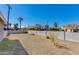 Backyard view with gravel landscaping and block fencing, offering a private outdoor space at 3601 N 12Th St, Phoenix, AZ 85014