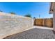 A brick paver patio enclosed by a block wall and a wooden fence at 3601 N 12Th St, Phoenix, AZ 85014