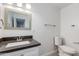 Bathroom featuring a dark countertop, decorative mirror, and modern fixtures at 3601 N 12Th St, Phoenix, AZ 85014