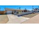 View of the exterior showcasing a garage and a well-maintained driveway and desert landscaping at 3601 N 12Th St, Phoenix, AZ 85014