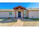 Charming home with a covered front entrance and a lovely brick walkway, and beige exterior at 3601 N 12Th St, Phoenix, AZ 85014