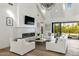 Cozy living room featuring a fireplace, stylish furniture, and seamless access to an outdoor pool area at 3808 E Fairmount Ave, Phoenix, AZ 85018