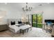 Serene main bedroom featuring a king-sized bed, an outdoor view, and a dedicated workspace at 3808 E Fairmount Ave, Phoenix, AZ 85018