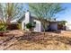 A backyard with stone-lined landscape borders and a chimney on the home's exterior at 3923 S Dorsey Ln, Tempe, AZ 85282