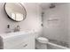 Modern bathroom with a walk-in shower featuring mosaic tile and sleek white vanity at 3923 S Dorsey Ln, Tempe, AZ 85282