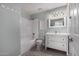 Bathroom features a modern vanity, framed mirror, tiled floors, and a shower-tub combo at 3923 S Dorsey Ln, Tempe, AZ 85282