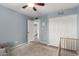 Bright bedroom features a ceiling fan, closet, and an open door to the ensuite bathroom at 3923 S Dorsey Ln, Tempe, AZ 85282