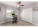 Bedroom area with a work desk, large window, and double door closet at 3923 S Dorsey Ln, Tempe, AZ 85282