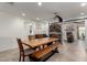 Dining room with large table, bench seating, and decorative barn door to the living room at 3923 S Dorsey Ln, Tempe, AZ 85282