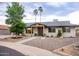 Charming home exterior featuring manicured landscaping, decorative rock, and covered entryway at 3923 S Dorsey Ln, Tempe, AZ 85282