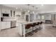 Bright kitchen with stainless steel appliances, island with seating, and a farmhouse sink at 3923 S Dorsey Ln, Tempe, AZ 85282