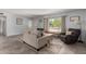 Welcoming living room with neutral tones, large window, and comfortable seating arrangement at 3923 S Dorsey Ln, Tempe, AZ 85282