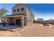 View of the backyard featuring a patio with a grill, a fire pit, and a gravel landscape at 3932 N 306Th Ln, Buckeye, AZ 85396