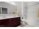 Bright bathroom featuring double sinks, a shower-tub combo, and ample lighting at 3932 N 306Th Ln, Buckeye, AZ 85396