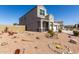 Beautiful home featuring a three-car garage and desert landscaping in the front yard at 3932 N 306Th Ln, Buckeye, AZ 85396