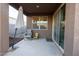 Covered patio featuring neutral tones, outdoor seating, and sliding glass doors enhancing indoor-outdoor living at 3982 E Sidesaddle Rd, San Tan Valley, AZ 85140