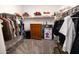 Walk-in closet with neutral carpet and an antique wooden dresser at 3982 E Sidesaddle Rd, San Tan Valley, AZ 85140