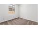 Small bedroom with neutral carpet and window at 40546 W Michaels Dr, Maricopa, AZ 85138