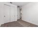 Neutral bedroom with closet, ensuite bathroom and natural light at 40546 W Michaels Dr, Maricopa, AZ 85138