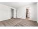 Bright bedroom with neutral carpet and ensuite bathroom with glass door at 40546 W Michaels Dr, Maricopa, AZ 85138