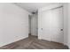 Bedroom with sliding closet doors, neutral carpet, and ensuite bathroom at 40546 W Michaels Dr, Maricopa, AZ 85138