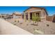 Lovely single-story home featuring a well-kept yard and a cozy, covered entryway at 40546 W Michaels Dr, Maricopa, AZ 85138