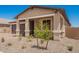 Charming single-story home with a welcoming front porch and low-maintenance desert landscaping at 40546 W Michaels Dr, Maricopa, AZ 85138