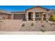 Charming single-story home featuring a two-car garage and desert landscaping at 40546 W Michaels Dr, Maricopa, AZ 85138