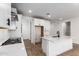 Bright kitchen with white cabinets, subway tile backsplash and stainless steel appliances at 40546 W Michaels Dr, Maricopa, AZ 85138