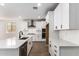 Bright kitchen with white cabinets, subway tile backsplash and stainless steel appliances at 40546 W Michaels Dr, Maricopa, AZ 85138