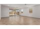 Spacious living area with sliding glass doors to outdoor patio at 40546 W Michaels Dr, Maricopa, AZ 85138