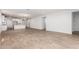 Spacious living area with wood-style tile flooring at 40546 W Michaels Dr, Maricopa, AZ 85138