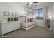 Charming bedroom features bunk beds, a dresser, and a window with plenty of natural light at 4132 E Santa Fe Ln, Gilbert, AZ 85297