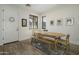 Bright dining area features an oval table, bench, and hardwood floors, perfect for Gathering meals at 4132 E Santa Fe Ln, Gilbert, AZ 85297