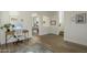 Bright entryway featuring wood-look tile flooring, arched doorways, and a staircase leading to the upper level at 4132 E Santa Fe Ln, Gilbert, AZ 85297