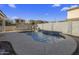 Backyard pool with a stone water feature; creating a relaxing oasis for Gathering and friends at 4132 E Santa Fe Ln, Gilbert, AZ 85297