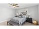 Comfortable bedroom featuring neutral tones, two windows, and a ceiling fan creating a serene and inviting space at 4239 E Mitchell Dr, Phoenix, AZ 85018