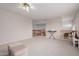 Upstairs bonus room with neutral carpet, wooden banister overlooking open floor plan, and adjacent landing area at 4801 E Quien Sabe Way, Cave Creek, AZ 85331