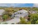 Two-story home showcasing desert landscaping, an attached two-car garage, and a neutral color scheme at 4801 E Quien Sabe Way, Cave Creek, AZ 85331