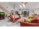 Open-concept living room with a stone accent wall, modern furnishings, and seamless flow to the kitchen at 4801 E Quien Sabe Way, Cave Creek, AZ 85331