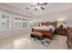 Serene main bedroom boasting tile floors, large windows, and plantation shutters that fill the room with light at 4801 E Quien Sabe Way, Cave Creek, AZ 85331